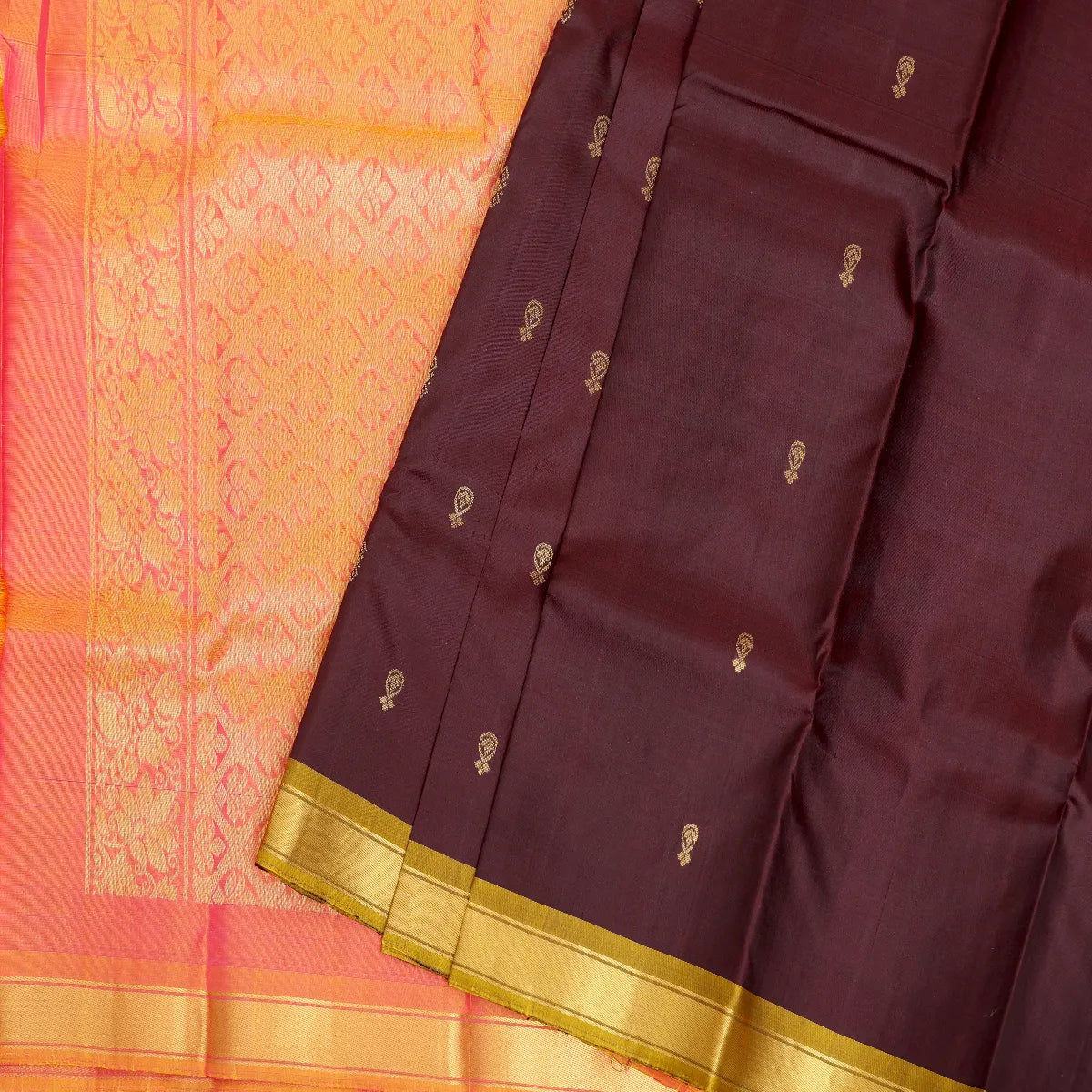 Deep brown with a vibrant coral-pink zari pallu kanjeevaram silk sari